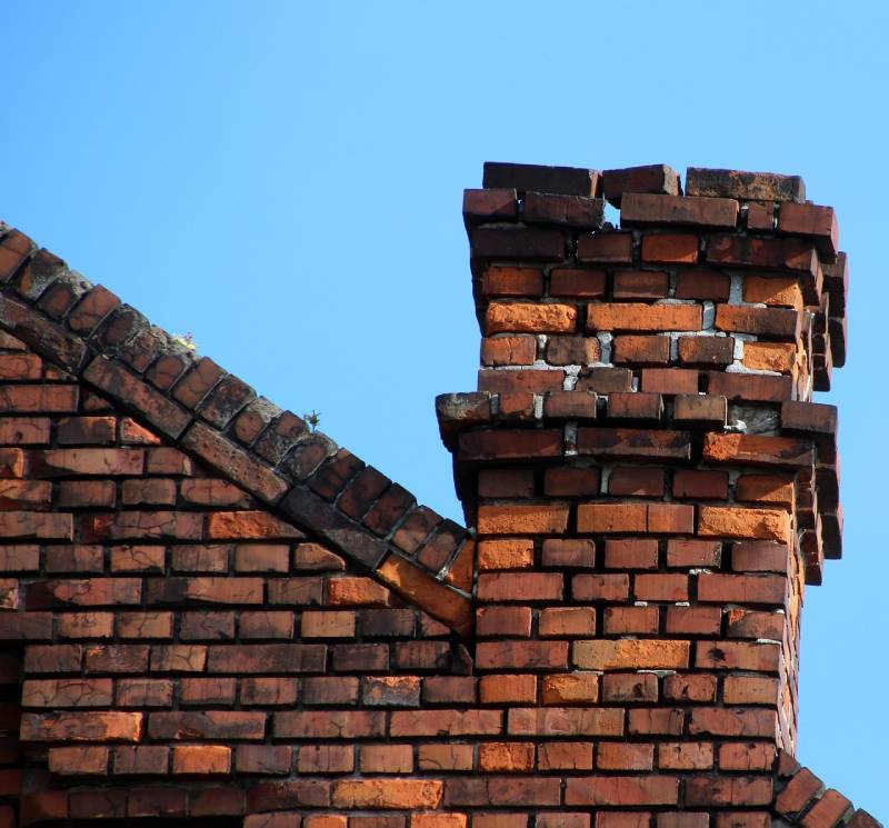 Signs Your Wheaton Home Needs a Chimney Inspection Damaged chimney on an Wheaton home showing cracks and missing mortar